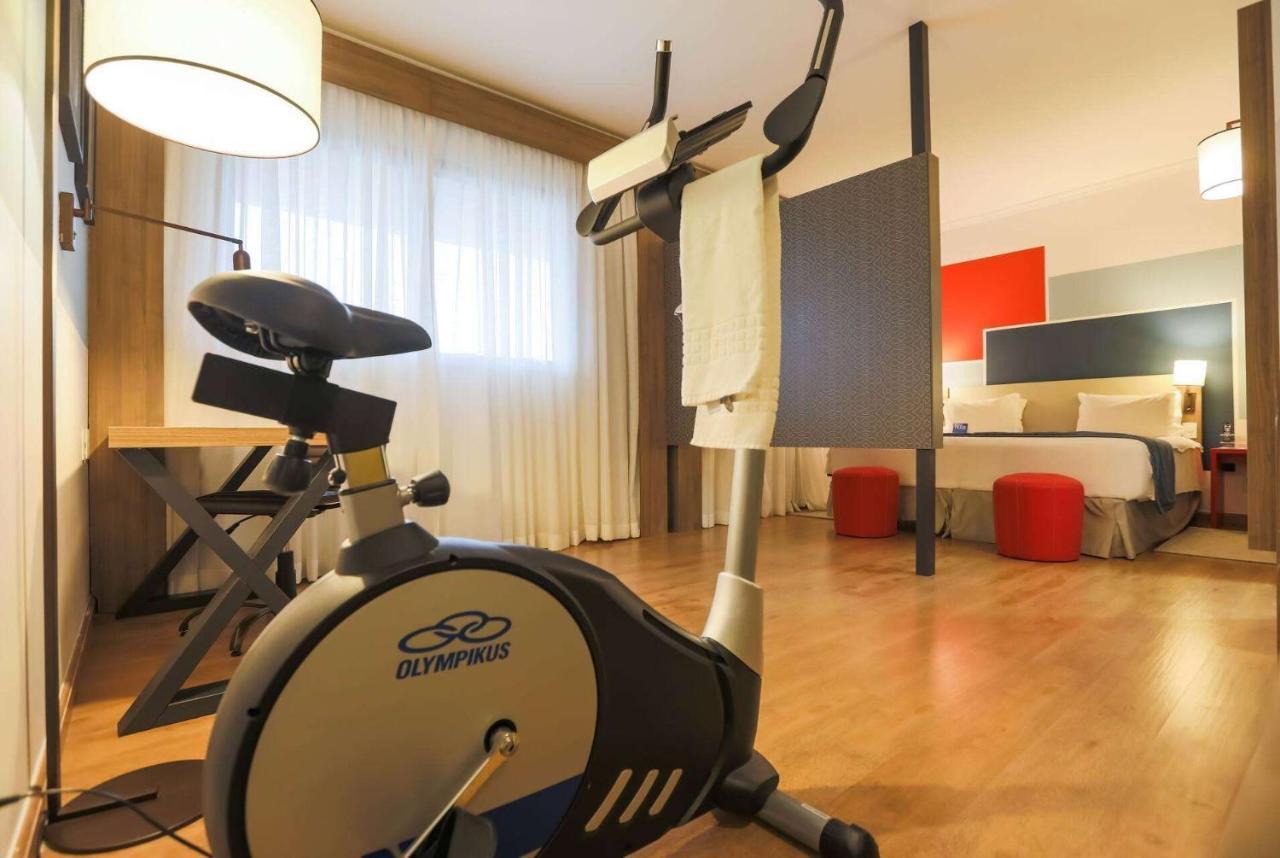 Tryp By Wyndham Ribeirao Preto Hotel Exterior photo An exercise bike in a hotel room