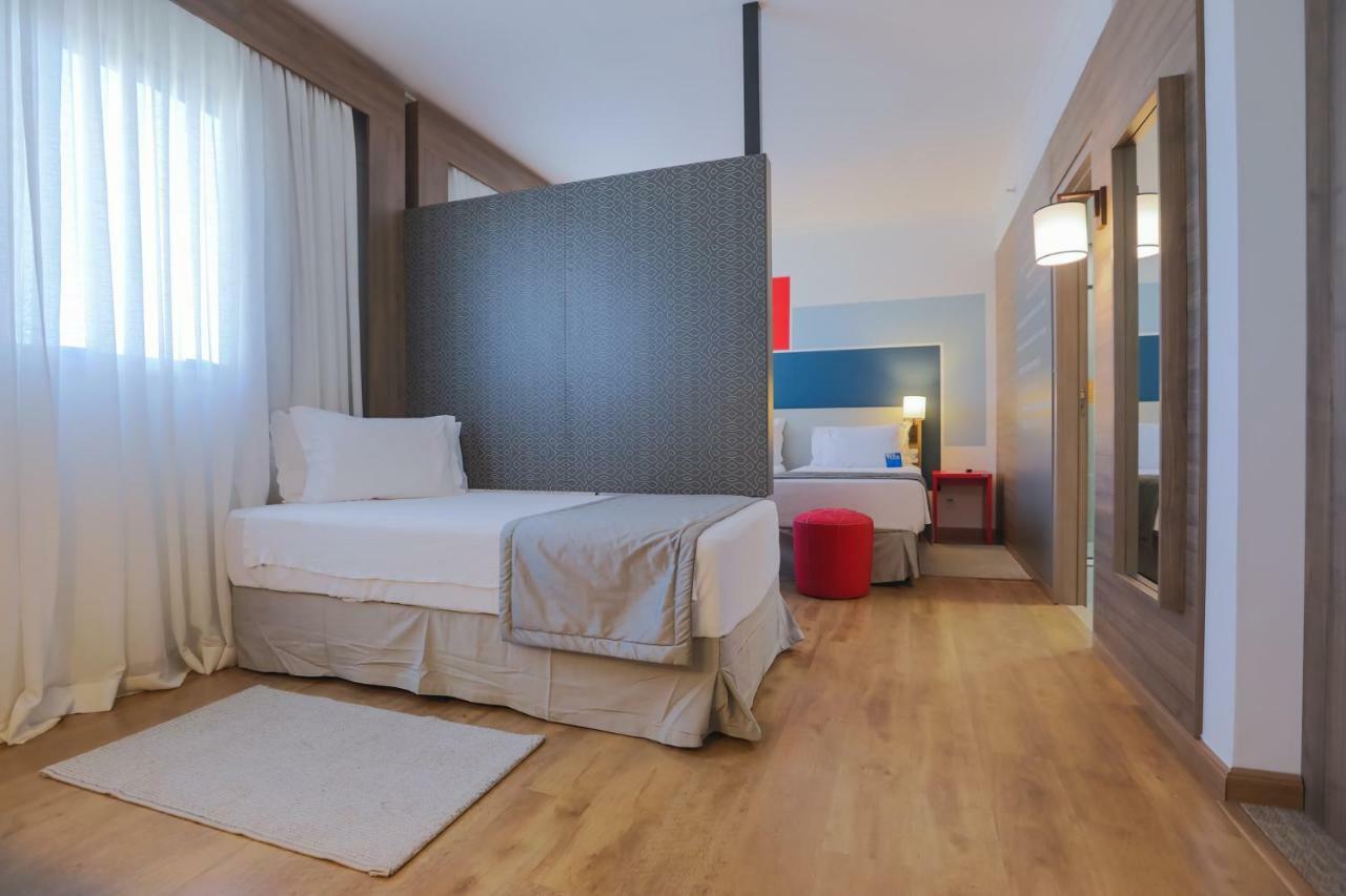 Tryp By Wyndham Ribeirao Preto Hotel Exterior photo A room at the hotel